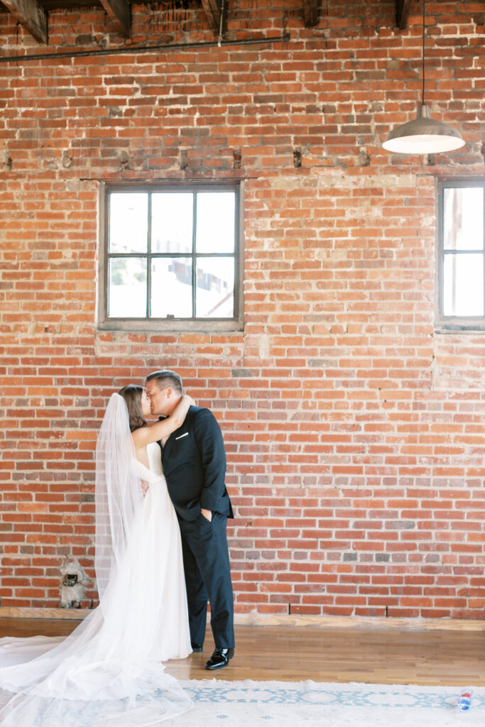 Bride and Groom kiss after their wedding ceremony in the downtown wedding venue the standard knoxville