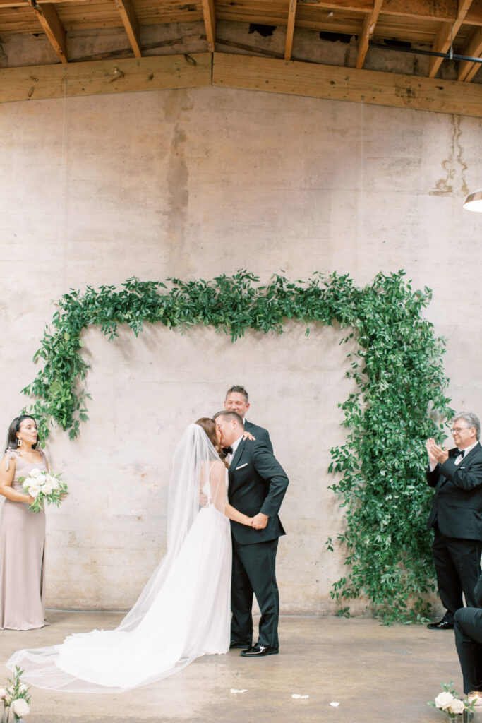 Bride and groom kiss for the first time as husband and wife